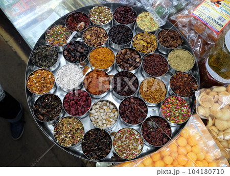 Different spices and herbs in metal bowls on a street market in Kolkata, West Bengal, India 104180710