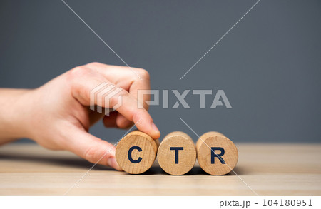 Wooden blocks with the word CTR - click through rate. Used to measure the effectiveness of marketing campaigns. Business management and analysis concept 104180951