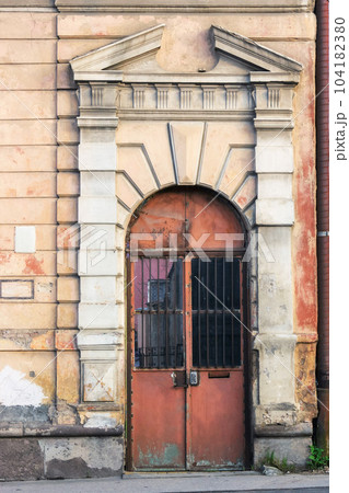 old door on the vintage facade. architectural element old door on the vintage facade. architectural element 104182380