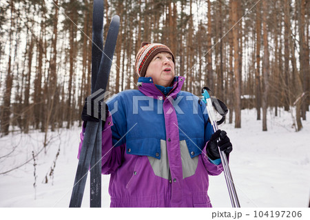 Portrait of a senior skier in a winter forest 104197206