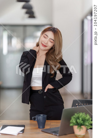 Smiling Asian Accountant person analyze financial report and studies annual figures, analyzes profits Smiling Asian Accountant person analyze financial report and studies annual figures, analyzes profits 104197207