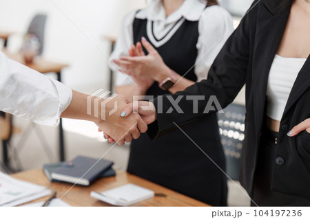 Business people handshake. Successful business person and client handshaking after good deal. Finishing up meeting concept Business people handshake. Successful business person and client handshaking after good deal. Finishing up meeting concept 104197236
