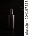 powerbank black on a black background, usb cable, plug, light and reflection 104197828