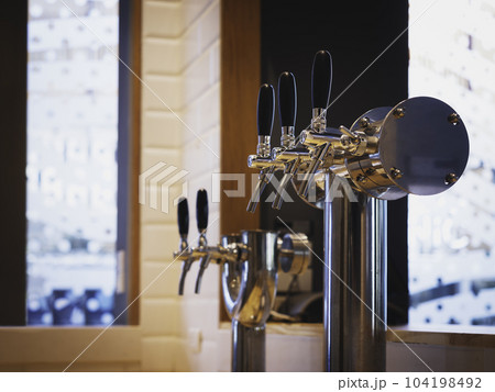 Beer tabs Alcohol drink counter Bar Restaurant interior Beer tabs Alcohol drink counter Bar Restaurant interior 104198492