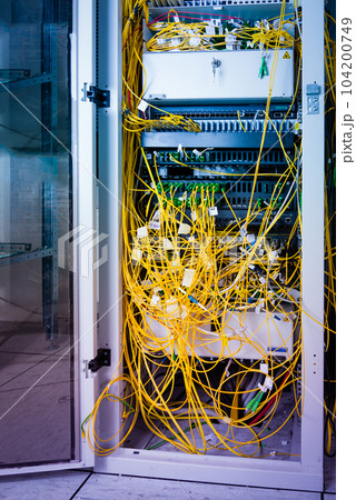 data center with servers and fiber optic cables data center with servers and fiber optic cables 104200749