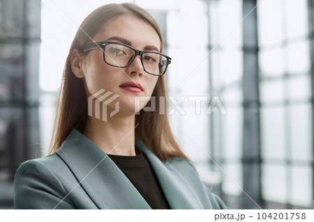 Dream big and make it happen. Portrait of a confident young businesswoman standing with her arms crossed in an office. 104201758