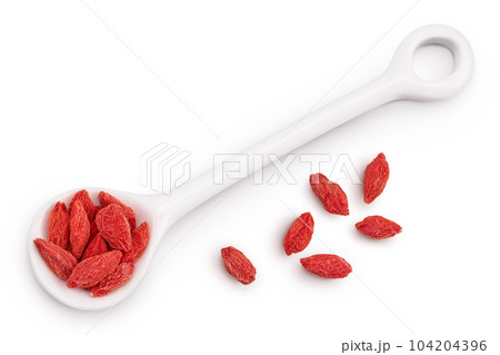 Dried goji berries in ceramic spoon isolated on white background. Top view. Flat lay. 104204396