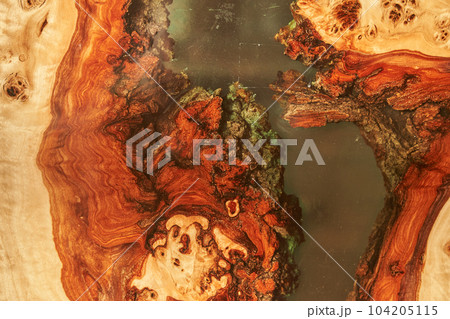 Wooden table covered with epoxy resin. Top view of a tree as a background with space to copy. High quality photo Wooden table covered with epoxy resin. Top view of a tree as a background with space to copy. High quality photo 104205115