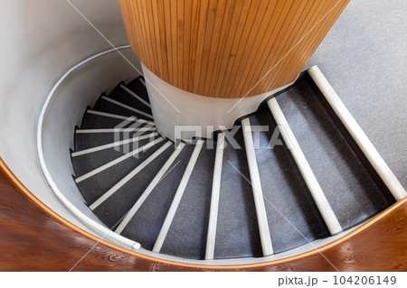 Spiral staircase goes down, top view, abstract architecture photo Spiral staircase goes down, top view, abstract architecture photo 104206149