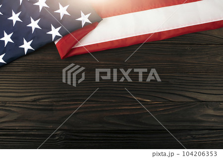 US flag flat lay on wooden background with copyspace 104206353