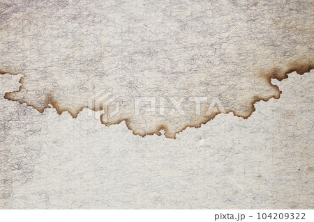 Old brown kraft paper with stains fringe lines texture 104209322