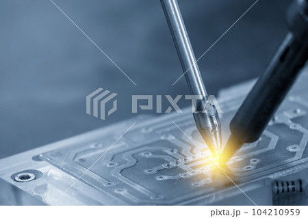 The automatic soldering machine operation with PCB board. 104210959