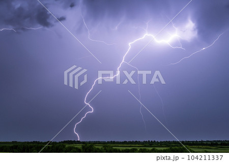 Ray. Lightning storm. Lightning bolt storm. Fork lightning striking. Lightning thunderstorm flash over the night sky. Concept on topic weather, cataclysms (hurricane, Typhoon, tornado, storm). 104211337