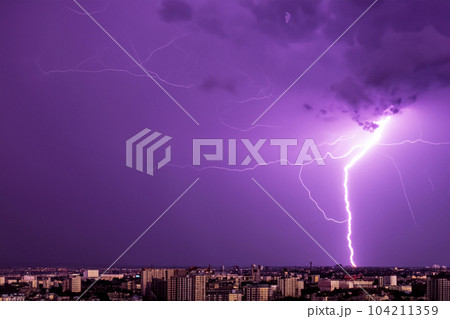 Ray. Lightning storm. Lightning bolt storm. Fork lightning striking. Lightning thunderstorm flash over the night sky. Concept on topic weather, cataclysms (hurricane, Typhoon, tornado, storm). Ray. Lightning storm. Lightning bolt storm. Fork lightning striking. Lightning thunderstorm flash over the night sky. Concept on topic weather, cataclysms (hurricane, Typhoon, tornado, storm). 104211359