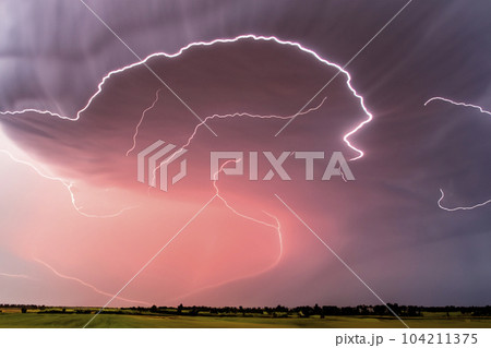 Ray. Lightning storm. Lightning bolt storm. Fork lightning striking. Lightning thunderstorm flash over the night sky. Concept on topic weather, cataclysms (hurricane, Typhoon, tornado, storm). 104211375