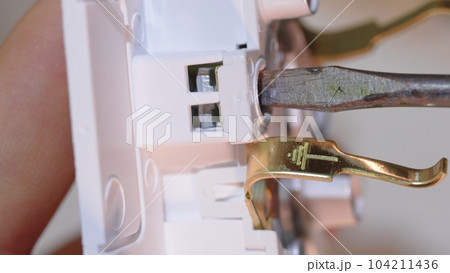 Connecting the ground wire to an electrical outlet. safety of use of electrical Connecting the ground wire to an electrical outlet. safety of use of electrical 104211436