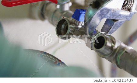 Connection of the water pipe. flexible hose. plumbing threaded connection. 104211437