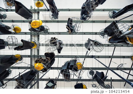 Scenic bottom view old abandoned coal mine worker clothing dressing room hanged at ceiling with chain lockers. Historical industrial mining museum Goslar tour. Industry decay recession concept Scenic bottom view old abandoned coal mine worker clothing dressing room hanged at ceiling with chain lockers. Historical industrial mining museum Goslar tour. Industry decay recession concept 104213454