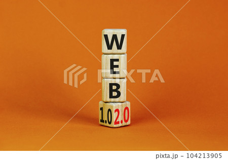 WEB 1.0 or 2.0 symbol. Turned a wooden cube and changed words WEB 1.0 to WEB 2.0. Beautiful orange table, orange background, copy space. Business, technology and WEB 1.0 or 2.0 concept. WEB 1.0 or 2.0 symbol. Turned a wooden cube and changed words WEB 1.0 to WEB 2.0. Beautiful orange table, orange background, copy space. Business, technology and WEB 1.0 or 2.0 concept. 104213905