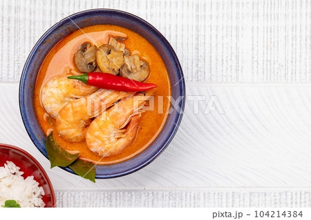 Thai Tom Yum Soup and bowl of rice 104214384