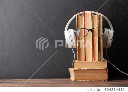 Old books, headphones and eyeglasses Old books, headphones and eyeglasses 104214412
