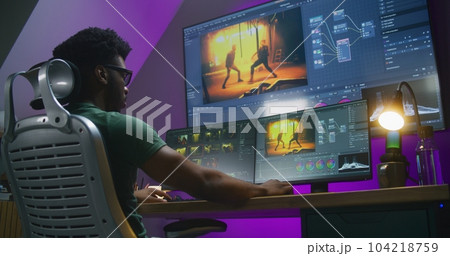 African American video editor makes color grading on PC African American video editor makes color grading on PC 104218759