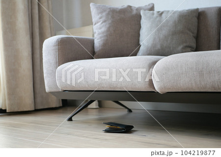 left wallet on floor at home  104219877
