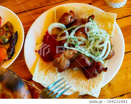 Pork shashlik with lavash and onion 104222881