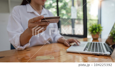Hands holding credit card and using laptop. Online shopping Hands holding credit card and using laptop. Online shopping 104225392