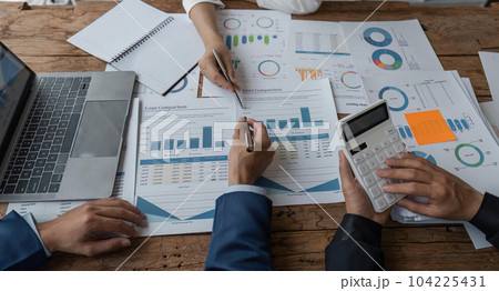 Business team analyzing income charts and graphs with modern laptop computer. Business analysis and strategy concept Business team analyzing income charts and graphs with modern laptop computer. Business analysis and strategy concept 104225431