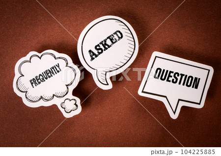 FAQ Frequently Asked Question. Speech bubbles with text on a brown background 104225885