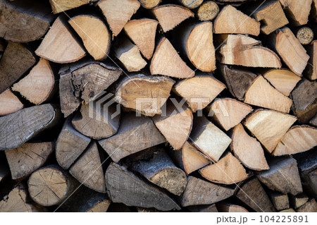 Background of sawn and split firewood. Heating and ecological Background of sawn and split firewood. Heating and ecological 104225891