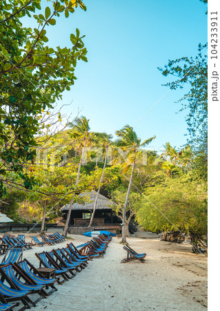 White beach and seaside chairs,relax in summer White beach and seaside chairs,relax in summer 104233911