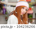 Asian American Woman in beanie cap 104236266