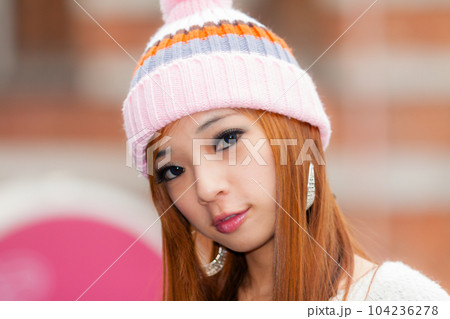 Asian American Woman in beanie cap 104236278