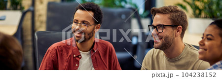 Group of young and happy diverse multi ethnic business people analyzing project results while working together in modern office or coworking space. Group of young and happy diverse multi ethnic business people analyzing project results while working together in modern office or coworking space. 104238152
