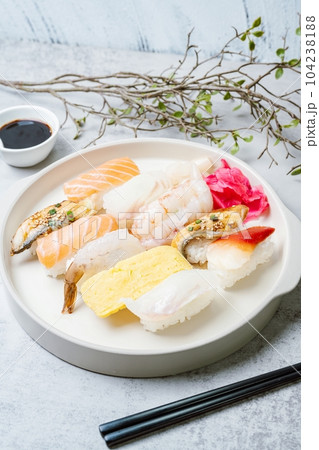 Fresh Japanese food sushi dishes on white plates Fresh Japanese food sushi dishes on white plates 104238188