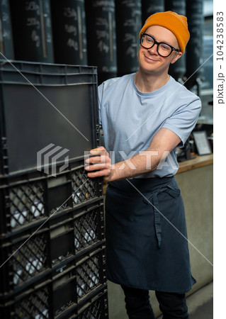 Barista bartender unloads new batch of coffee for coffee brewing in cafe. 104238583
