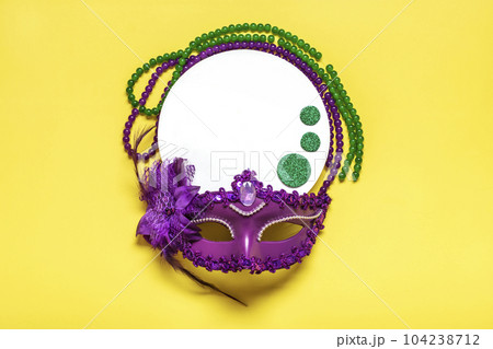 Mardi gras lettering. Congratulation card with violet mask on yellow background Top view 2023 Mardi Gras Parade Schedule Mockup Copy space. Mardi gras lettering. Congratulation card with violet mask on yellow background Top view 2023 Mardi Gras Parade Schedule Mockup Copy space. 104238712