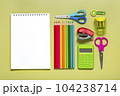 Frame from school and office supplies Paper clips, pens, calculator, sharpener, notepad, stapler isolated on green background Flat lay Top view Back to school, education concept Mock up Copy space. 104238714