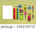 Frame from school and office supplies Paper clips, pens, calculator, sharpener, notepad, stapler isolated on green background Flat lay Top view Back to school, education concept Mock up Copy space. 104238715