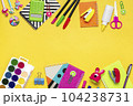 Back to school, education concept. Yellow backpack with school supplies - notebook, pens, ruler, calculator, scissors isolated on yellow background. 104238731