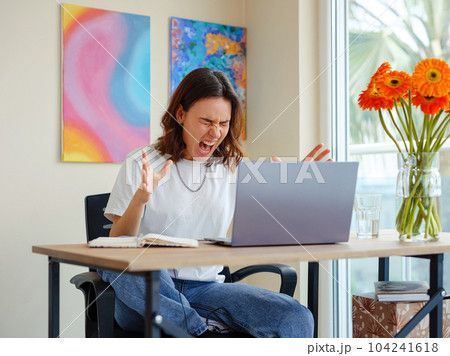 woman using laptop while working indoors woman using laptop while working indoors 104241618