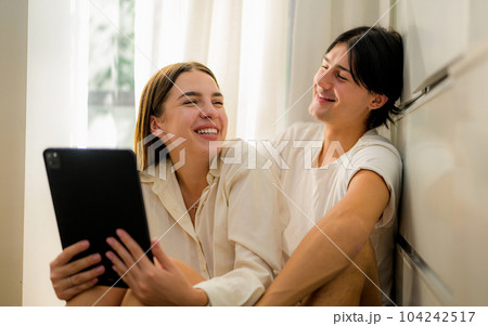 Romantic young people spending vacation time together at home 104242517