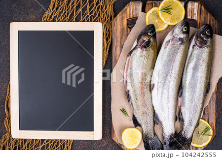 Raw uncooked trout with lemon Raw uncooked trout with lemon 104242555