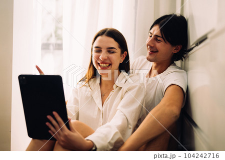 Couple of romantic young people at home, Vintage style photo Couple of romantic young people at home, Vintage style photo 104242716