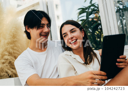 Couple of romantic young people at home, Vintage style photo 104242723