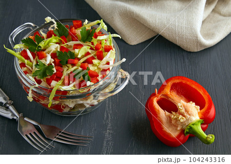 Summer salad is a light appetizer of white cabbage and bell pepp 104243316
