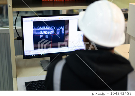 Quality control engineer specialist checking and inspecting circuit board 104243455