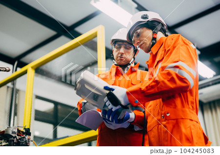 Robotics engineers team discussing and solving problems 104245083